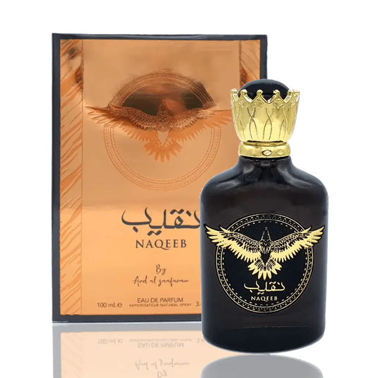 A fragrance bottle of Ard Al Zaafaran Naqeeb 100ml Eau de Parfum from Dubai Perfumes positioned in front of a box.