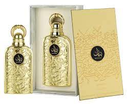 Two ornate golden Lattafa Bayaan 100ml Eau De Parfum bottles in an open box next to a matching golden case with Arabic script and intricate designs.