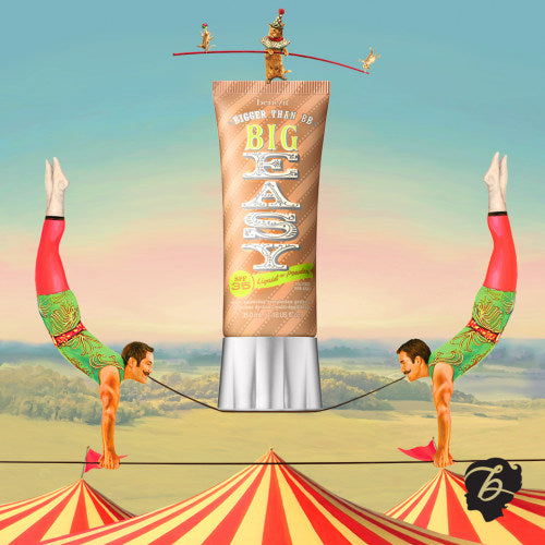 A tube of BENEFIT Big Easy BB Cream-Foundation - Assorted Shades with lightweight coverage and SPF 35, featuring two men on top of a circus tent. (Brand Name: Benefit)