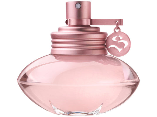 A pink Shakira perfume bottle emitting a feminine fragrance on a white background.