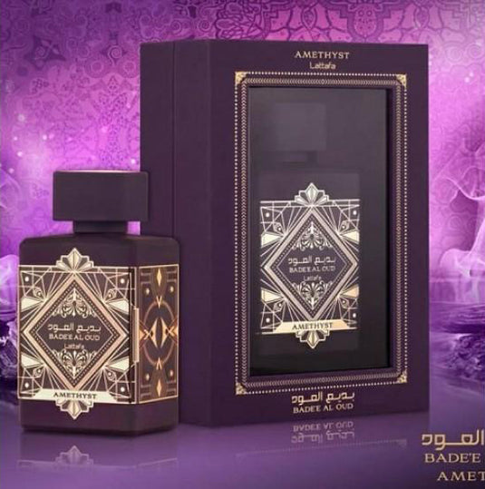 A bottle of Lattafa Badee Al Oud Amethyst 100ml Eau De Parfum in a purple box.
