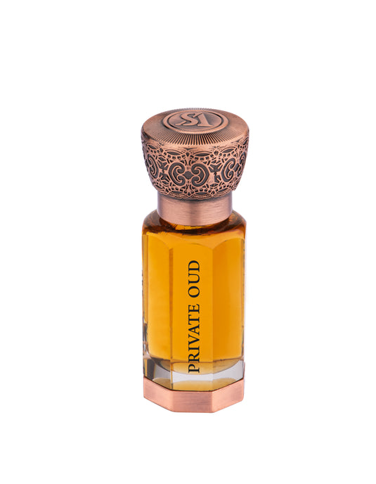 A bottle of Swiss Arabian Private Oud 12ml Concentrated Perfume Oil with a copper lid.
