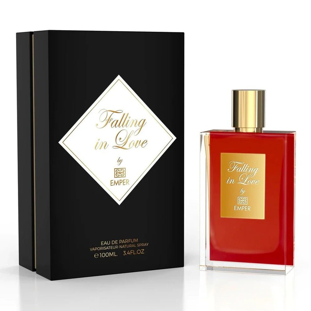 The Emper Falling in Love 100ml Eau De Parfum is an enchanting Oriental Gourmand fragrance for men and women. It features a red-tinted scent, a gold cap, and comes in elegant black and gold packaging.