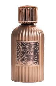 Paris Corner Qissa Delicious 100ml Eau De Parfum features a metallic bronze bottle with vertical ridges and an abstract line art label, offering a captivating unisex fragrance from Paris Corner.