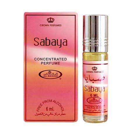 A 6ml bottle of Crown Perfumes Al-Rehab Sabaya Concentrated Oil Perfume is displayed next to its pink and orange box, marked "free from alcohol." This Arabian scent combines rose and musk notes.