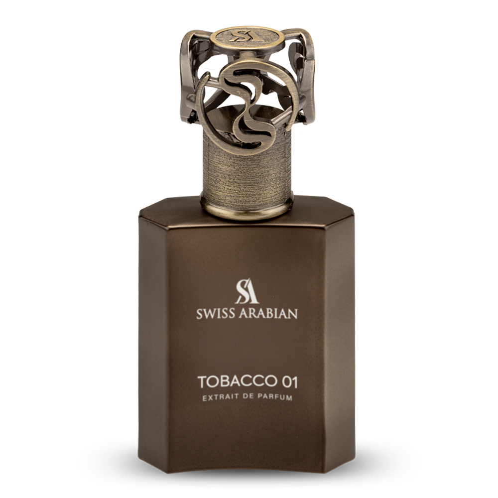A brown bottle of Swiss Arabian Tobacco 01 Extrait De Parfum, a unisex fragrance by Swiss Arabian with a metallic cap, is shown against a plain white background.