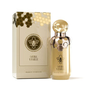 A gold perfume bottle with honeycomb and bee motifs stands beside its box, displaying "Paris Corner Miel Vanille 100ml EDP," an Oriental Vanilla fragrance by Paris Corner.