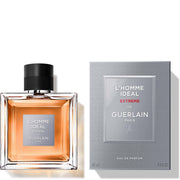 A bottle of Guerlain L’Homme Ideal Extreme 100ml Eau De Parfum is displayed beside its matching grey box packaging.