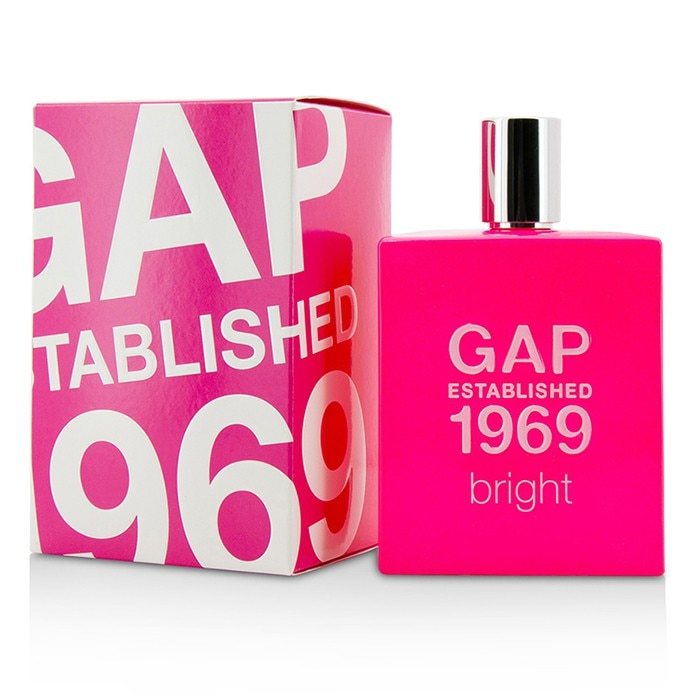 A vibrant pink bottle and box of GAP Established 1969 Bright 50ml Eau De Toilette, featuring bold white lettering from the brand Gap.