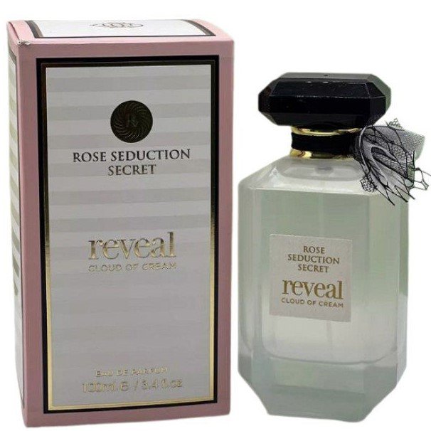 A boxed Fragrance World Rose Seduction Secret Reveal Cloud Of Crème 100ml EDP stands beside its matching glass bottle with a black cap and bow, capturing the oriental gourmand essence of this Eau De Parfum.
