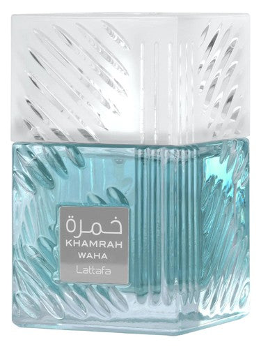 Lattafa Khamrah Waha 100ml EDP comes in a square glass bottle with textured sides, light blue liquid, and a frosted cap. The label shows the name in English and Arabic, mirroring the modern, woody intensity of this Lattafa fragrance.