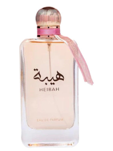 The Ard Al Zaafran Heibah 100ml Eau De Parfum comes in a clear glass bottle with "HEIBAH" and Arabic script, a pink-gold cap, and a pink ribbon, embodying its signature Oriental Floral fragrance.