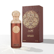 A 200ml bottle of Gissah La Luna Eau De Parfum stands next to its ornate brown and gold box, reflecting the brand's signature Oriental Ambery Woody scent.