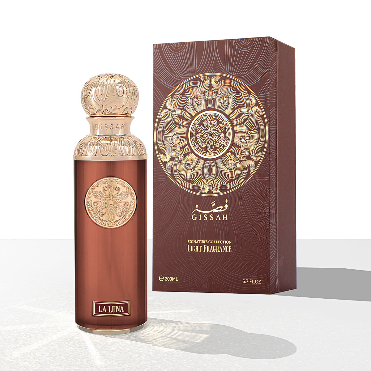 A 200ml bottle of Gissah La Luna Eau De Parfum stands next to its ornate brown and gold box, reflecting the brand's signature Oriental Ambery Woody scent.