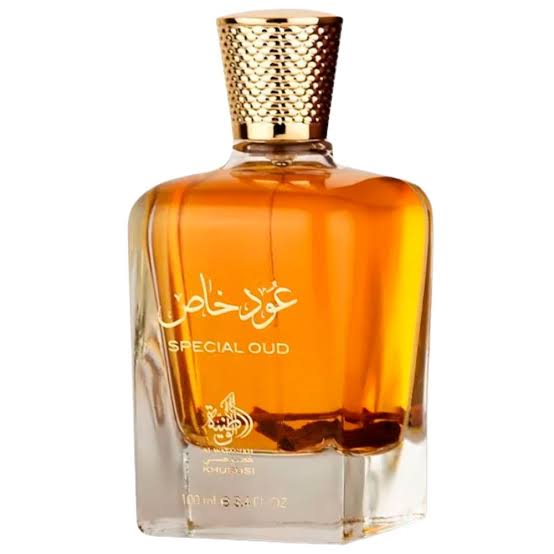 The Al Wataniah Special Oud 100ml Eau De Parfum comes in a rectangular glass bottle adorned with elegant gold Arabic script and a textured gold cap, showcasing the brand's signature rich amber fragrance.
