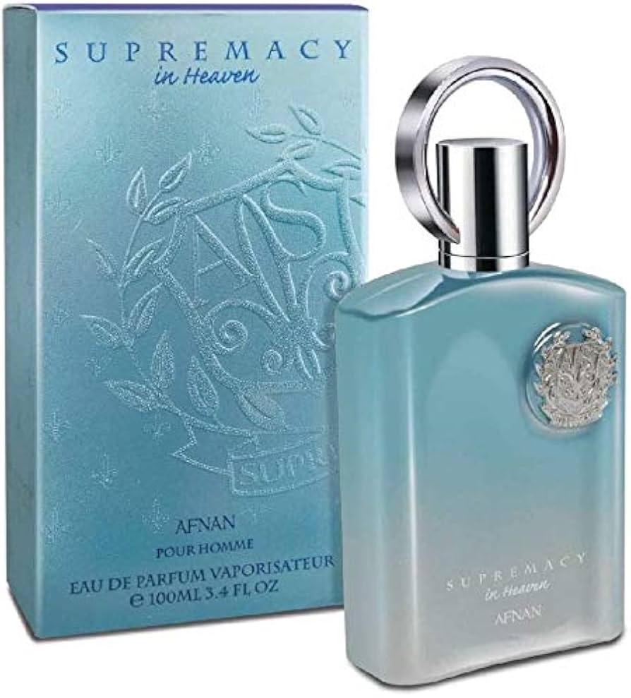 A 100ml blue bottle of Afnan Supremacy in Heaven EDP is shown beside its box, featuring a silver cap and decorative emblem.