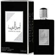 A sleek black rectangle bottle of Asdaaf Ameer Al Arab 100ml EDP stands by its matching black box with silver accents and Arabic script, representing a luxurious unisex fragrance by Asdaaf.