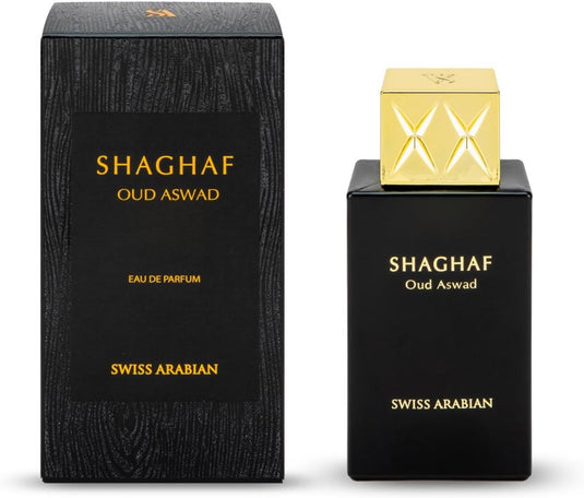 A bottle and box of Swiss Arabian Shaghaf Oud Aswad Black Oud 75ml Eau De Parfum. The box is black with gold text, while the bottle features a gold cap and black body with similar gold text. This exquisite oud perfume is a unisex fragrance that exudes sophistication and elegance.

