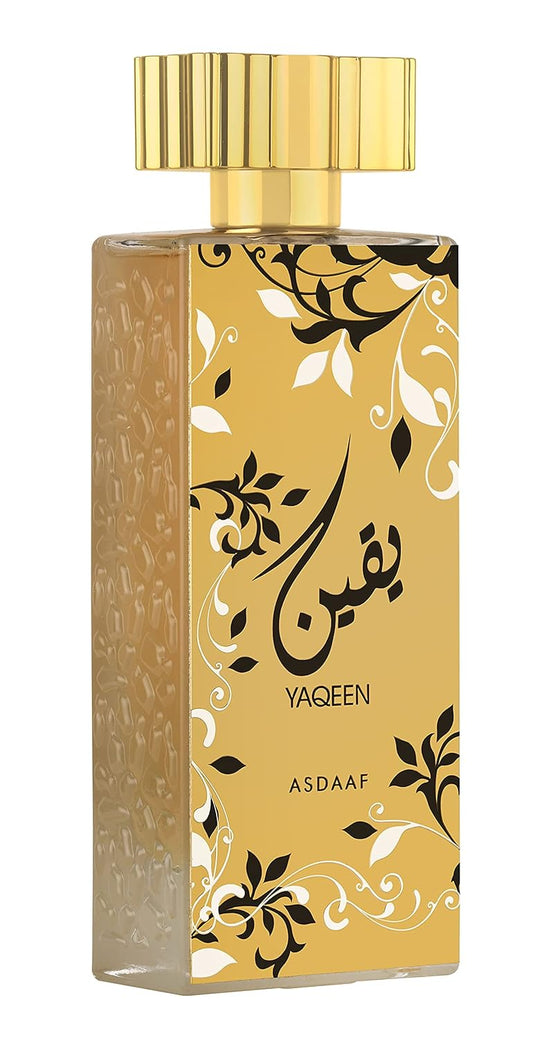 A bottle of Dubai Perfumes Asdaaf Yaqeen 100ml Eau De Parfum, featuring an ornate gold and black design.