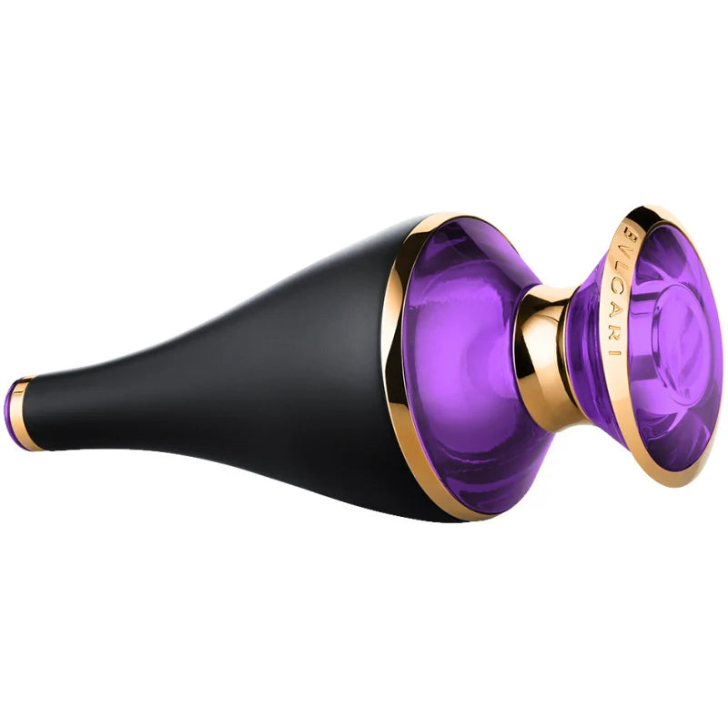 A 30ml bottle of Bvlgari Le Gemme Ashlemah EDP features a black matte body, gold accents, and a transparent purple disc-shaped cap, shown lying on its side.