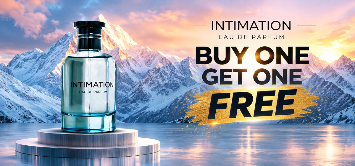 A bottle of Emper Intimation 100ml EDP by Emper is displayed gracefully on a pedestal before a sweeping mountain backdrop, highlighted by bold text reading “BUY 1 GET 1 FREE.” Experience the refined charm of this distinctive fragrance, designed for those who appreciate sophistication in every spritz.
