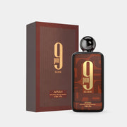 A bottle and box of Afnan 9PM Elixir Intense 100ml EDP by Afnan, a unisex fragrance with a brown and gold geometric design, both displaying bold "9PM Elixir" text.