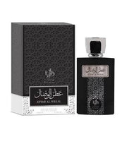 A black bottle of Al Wataniah Attar Al Wesal 100ml EDP (best ultra male) by Al Wataniah is displayed beside its matching decorative box, both adorned with Arabic and English text. This Oriental Spicy unisex fragrance is distinguished by its elegant packaging and broad appeal.