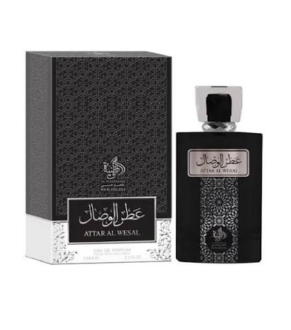 A black bottle of Al Wataniah Attar Al Wesal 100ml EDP (best ultra male) by Al Wataniah is displayed beside its matching decorative box, both adorned with Arabic and English text. This Oriental Spicy unisex fragrance is distinguished by its elegant packaging and broad appeal.