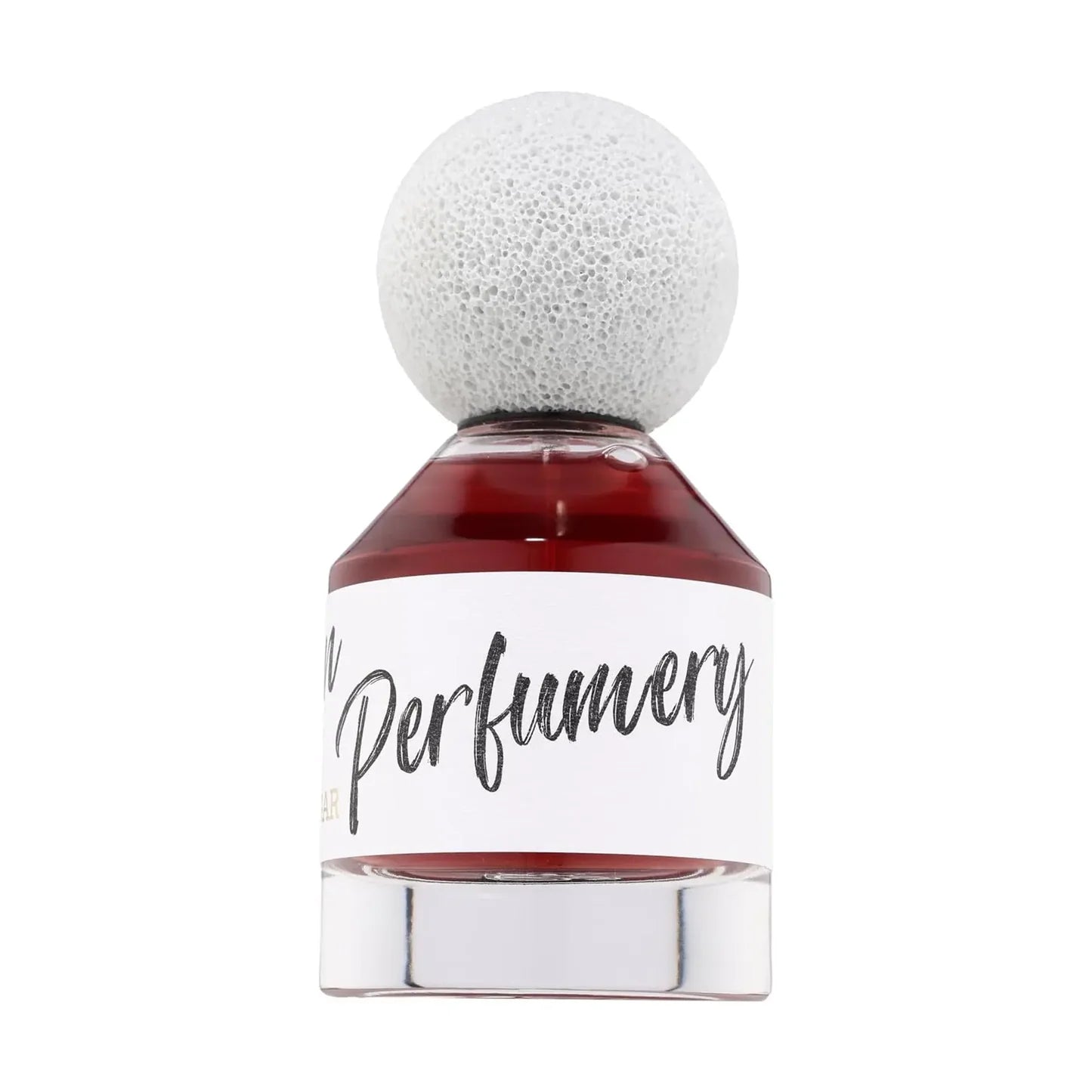 The Fragrance World Brown Sugar Artisan Perfumery 80ml Eau De Parfum comes in a glass bottle with red liquid, a white textured spherical cap, and a white label reading “Perfumery” in cursive—a sophisticated tribute to fragrance artistry.