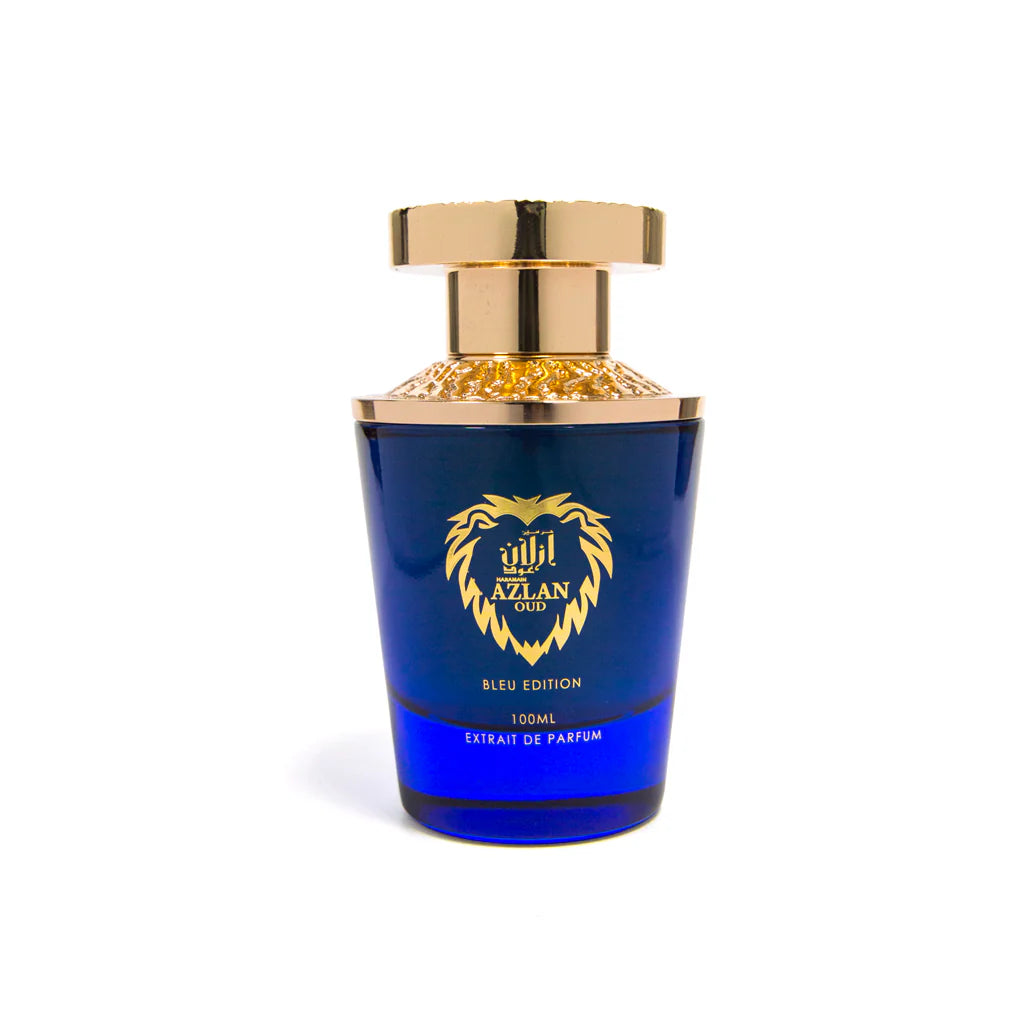 A blue and gold AL Haramain Azlan Oud Bleu Edition 100ml Extrait De Parfum bottle features a lion head logo on the front.