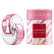 The Bvlgari Omnia Pink Sapphire 65ml EDT bottle, with its pink and silver design, stands beside its cylindrical pink and white striped packaging, echoing the fragrance’s bright and vibrant character.