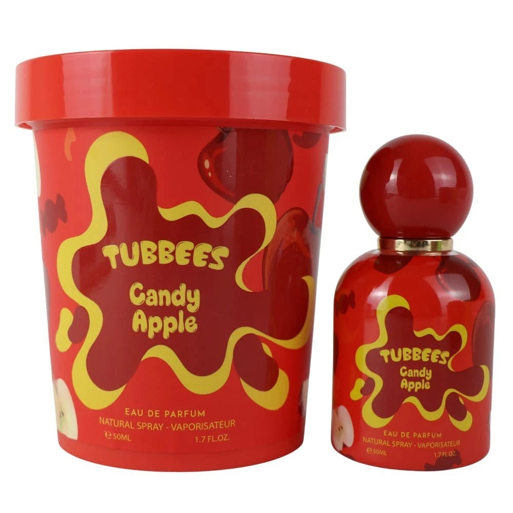Tubbies Tubbees Candy Apple EDP comes in a perfume bottle and matching cylindrical box, both with yellow text and apple motifs, capturing the playful gourmand essence of this unisex fragrance.