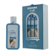 Riiffs Perfumes Seasons Drift 100ml EDP comes in a blue bottle and box, with packaging that showcases a boardwalk beach scene viewed through an arched window.