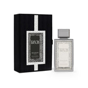 A rectangular bottle of Maison Asrar DXB 100ml EDP, presented alongside its coordinating black and silver box adorned with a decorative geometric pattern, embodies the refined essence of Maison Asrar with its Citrus Aromatic fragrance—a sophisticated unisex Eau de Parfum crafted for any occasion.
