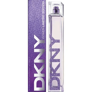 A DKNY Ladies Limited Edition 100ml EDT stands by its matching purple box, both with bold DKNY branding and a glittery finish, celebrating a cheerful fragrance with bergamot and peony notes.
