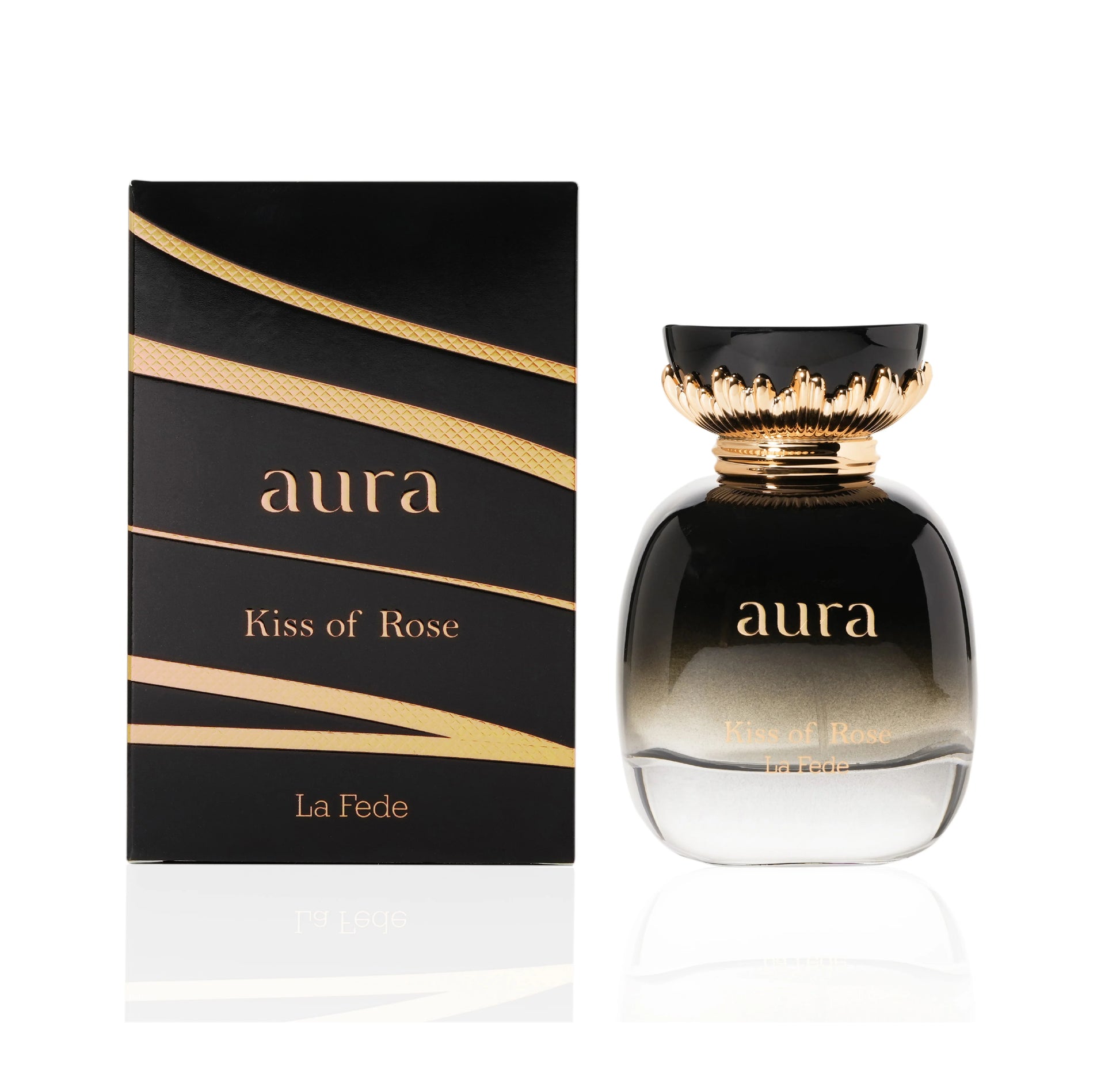 A perfume bottle labeled "Khadlaj La Fede Aura Kiss of Rose 100ml Eau De Parfum" is showcased next to its matching black and gold packaging. The clear bottle with a black top adorned in gold detailing embodies the essence of Eau de Parfum, delivering a captivating fragrance for men & women.