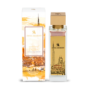 A bottle of Swiss Arabian Opulence Of Dubai 100ml Extrait de Parfum by Swiss Arabian is displayed beside its decorative box adorned with illustrations of the Dubai cityscape.