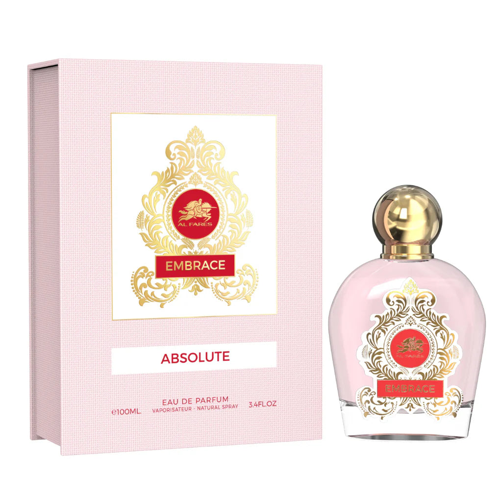 The Al Fares Embrace Absolute Eau De Parfum by Rio Perfumes comes in a 100ml bottle with a gold cap. The packaging boasts elegant gold and red designs, offering an amber woody scent that is a luxurious unisex fragrance.