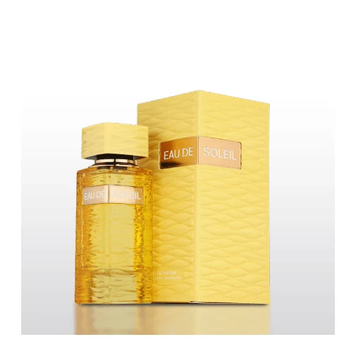 A yellow bottle of Fragrance World Eau De Soleil 100ml EDP stands beside its matching textured yellow box against a white background, inviting you to discover its radiant blend of floral, fruity, and gourmand notes.