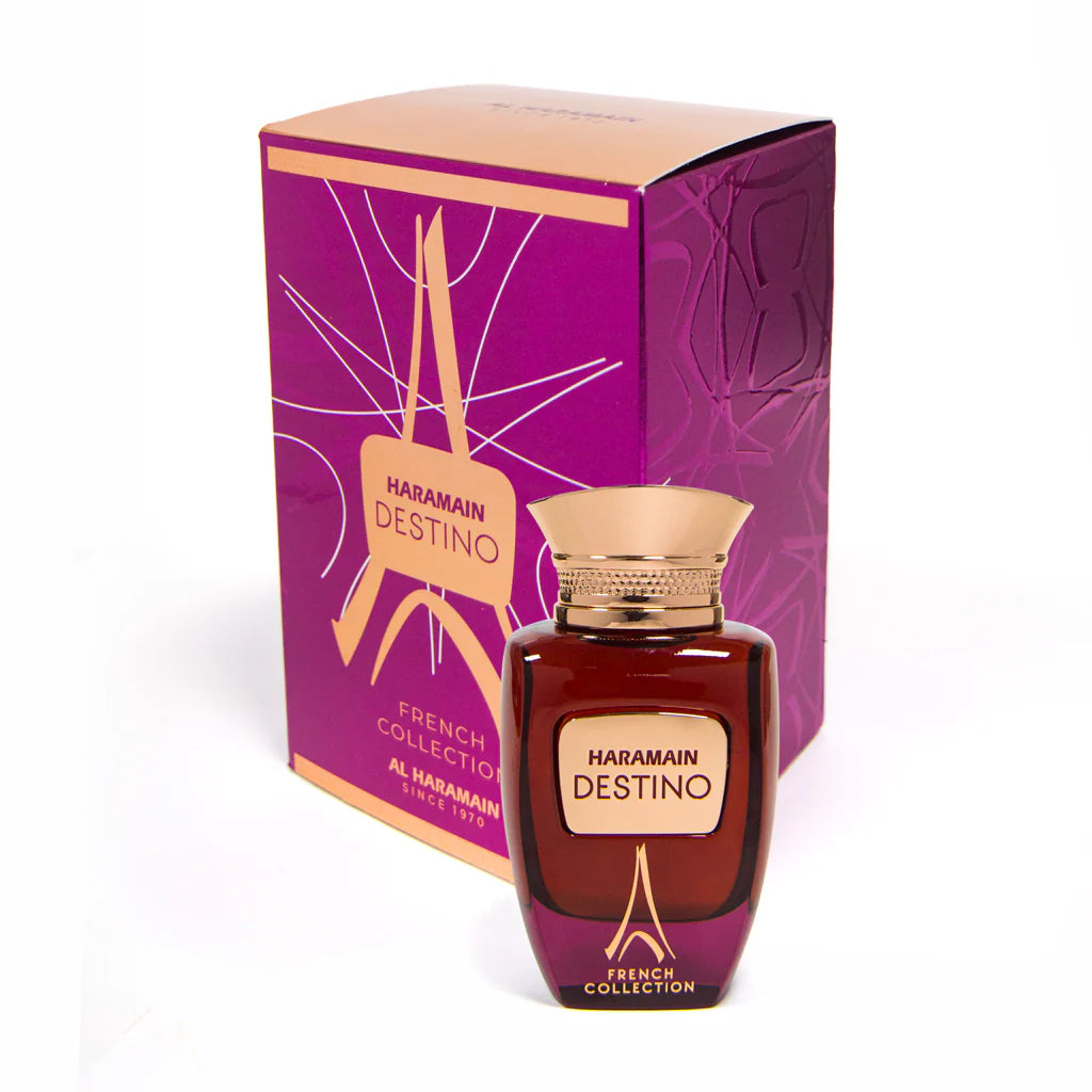 Al Haramain Destino French Collection 100ml EDP by AL Haramain is displayed elegantly in front of its sophisticated purple and gold packaging.