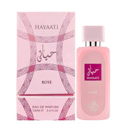 A pink box and matching bottle of Fragrance World Hayaati Rose 100ml EDP, featuring decorative patterns and white and purple labeling.