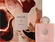 A pink bottle of Amouage Guidance 100ml EDP by Amouage, a luxurious unisex fragrance with floral and fruity notes, is shown in front of its decorative abstract-patterned box.