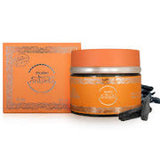 An orange jar with a matching orange and silver box labeled "Bakhoor Oudh Nabeel Incense 60g" by Rio Perfumes is displayed with dark incense wood pieces—ideal for lovers of aromatic oils.