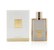A bottle of Khadlaj Karus Secret Musk 100ml EDP by Khadlaj is displayed beside its white and gold box, highlighting this elegant unisex eau de parfum.