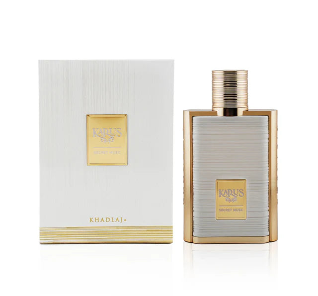 A bottle of Khadlaj Karus Secret Musk 100ml EDP by Khadlaj is displayed beside its white and gold box, highlighting this elegant unisex eau de parfum.