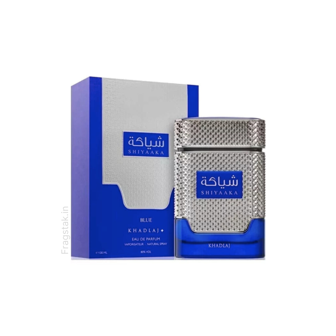 A 100ml bottle of Khadlaj Shiyaaka Blue Eau de Parfum sits beside its blue and white box with silver accents and Arabic text.