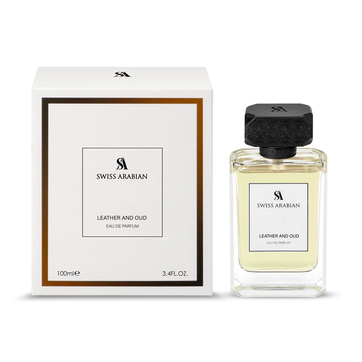 Swiss Arabian Leather and Oud 100ml Eau De Parfum is displayed beside its elegant white and gold box. This luxurious Swiss Arabian fragrance comes in a 100ml (3.4 fl. oz.) bottle.