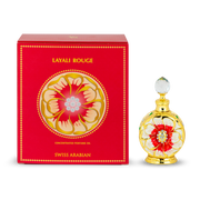 A red box labeled "Swiss Arabian Layali Rouge 20ml Concentrated Perfume Oil" sits next to an ornate gold and red bottle with a clear round cap, highlighting this fruity floral scent by Swiss Arabian.