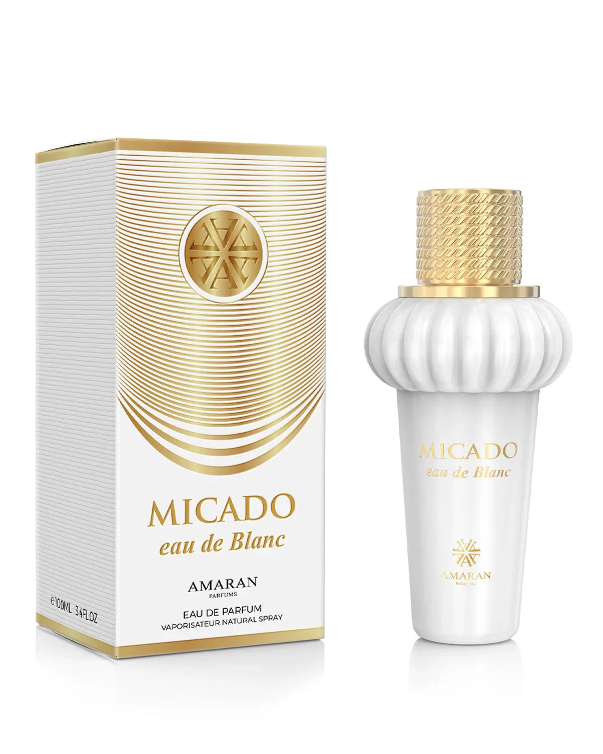 A white and gold Amaran Micado Eau De Blanc 100ml EDP unisex perfume bottle stands beside its matching box, both featuring elegant gold and white design accents.
