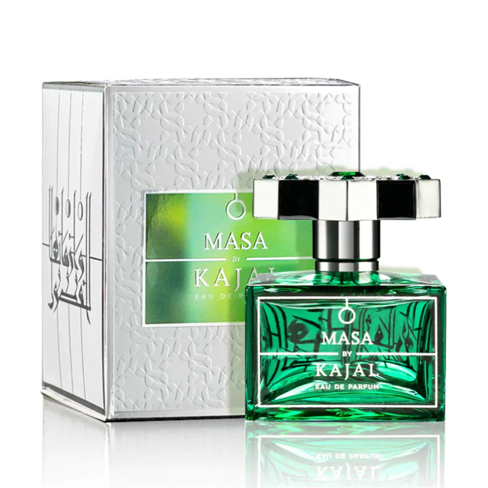 A green glass bottle of Masa Kajal by Kajal, a unisex Eau de Parfum, sits before its corresponding white and green box.